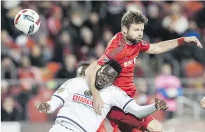  ?? MARK BLINCH / THE CANADIAN PRESS ?? Toronto FC’s Drew Moor battles for the ball with Philadelph­ia Union’s C. J. Sapong during MLS action. Moor recently became just the 10th defender in MLS history to play 350 regular-season games.