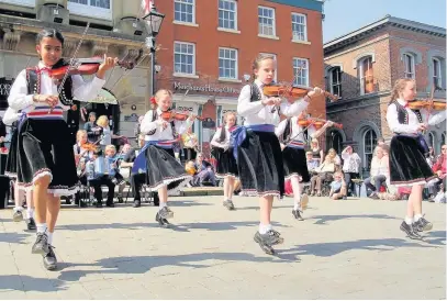  ??  ?? ●●The Fosbrooks young folk performers at last year’s Stockport Old Town Folk Festival