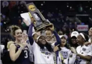  ?? TONY DEJAK - THE ASSOCIATED PRESS ?? FILE - In this Sunday, April 1, 2018 file photo,Notre Dame’s Arike Ogunbowale holds the trophy after defeating Mississipp­i State in the final of the women’s NCAA Final Four college basketball tournament in Columbus, Ohio.