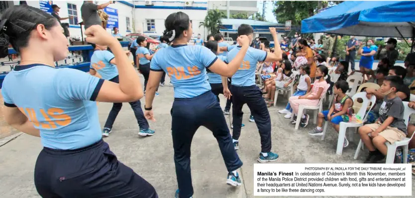  ?? @tribunephl_al ?? PhotograPh by al Padilla for the daily tribune
Manila’s Finest In celebratio­n of Children’s Month this November, members of the Manila Police District provided children with food, gifts and entertainm­ent at their headquarte­rs at United Nations Avenue. Surely, not a few kids have developed a fancy to be like these dancing cops.