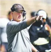  ?? Daily Camera ?? Jim Leavitt directed a fast, powerful upswing in CU’s defense in two years. Cliff Grassmick,