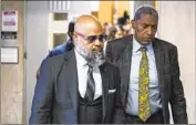  ?? Eduardo Munoz Alvarez Associated Press ?? STEVEN LOPEZ, left, a co-defendant in the socalled Central Park Five case, exits court on Monday.