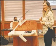  ?? (NWA Democrat-Gazette/Mary Jordan) ?? Ally Mrachek, Fayettevil­le School District child nutrition director, speaks to the School Board on Thursday about the district’s food service program.