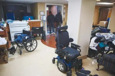  ?? VANESSA ABBITT/ST. LOUIS POST-DISPATCH VIA AP ?? On Saturday, mobility equipment and other things are left near the lobby of Northview Village Nursing Home in St. Louis.