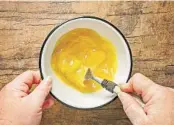  ?? ?? Whisk the eggs, water, bourbon and melted butter, beating well. Pour into the peanut butter mixture and mix until smooth.