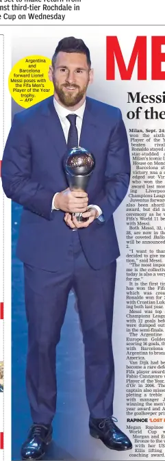  ?? — AFP ?? Argentina and Barcelona forward Lionel Messi poses with the Fifa Men’s Player of the Year trophy.