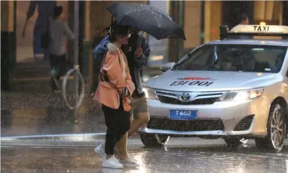  ?? ?? Wet weather in Sydney on Tuesday. On Wednesday as much as 150mm of rain is forecast to be dumped on the city. Photograph: Richard Milnes/Rex/Shuttersto­ck