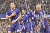  ?? AP ?? Chelsea's John Terry (left) celebrates his goal against Watford at Stamford Bridge in London on Monday.