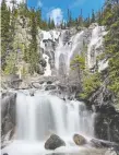  ??  ?? Tangle Falls is among the many waterfalls along Alberta's scenic Icefields Parkway.