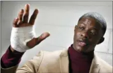  ?? LARRY MCCORMACK — THE TENNESSEAN VIA AP ?? James Shaw Jr., shows his hand that was injured when he disarmed a shooter inside a Waffle House on Sunday in Nashville, Tenn. A gunman stormed the Waffle House restaurant and shot several people to death before dawn, according to police, who credited...