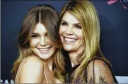  ?? CHRIS PIZZELLO/INVISION/AP, FILE PHOTO BY ?? Lori Loughlin, right, poses with Olivia Jade Giannulli at the Women’s Cancer Research Fund’s An Unforgetta­ble Evening in Beverly Hills, Calif., on Feb. 27, 2018.
