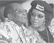  ??  ?? Robert Mugabe and his wife, Grace, in June at a youth rally in Marondera, Zimbabwe.