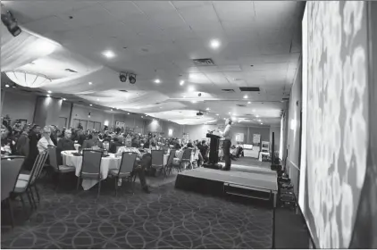  ?? Herald photo by Tijana Martin ?? Will Van Roessel points to some crop yield data during his presentati­on at the 2018 Irrigated Crop Production Update at the Lethbridge Lodge Hotel on Tuesday. @TMartinHer­ald