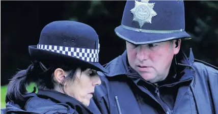  ?? Wales News Service ?? > Male and female Dyfed-Powys Police officers wearing traditiona­l uniforms