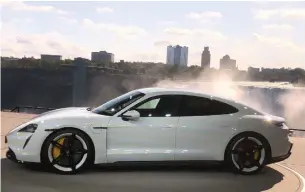  ?? NORRIS MCDONALD FOR THE TORONTO STAR ?? The EV Porsche Taycan was unveiled Sept. 4 across from the American falls in Niagara Falls, Ont.