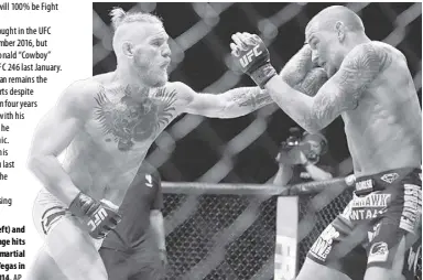  ?? AP ?? Conor Mcgregor (left) and Dustin Poirier exchange hits during their mixed martial arts bout in Las Vegas in September 2014.