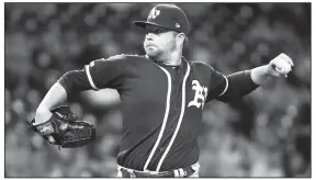  ?? AP/ERIC CHRISTIAN SMITH ?? Oakland Athletics starting pitcher Brett Anderson delivers during the first inning against the Houston Astros on Wednesday in Houston.