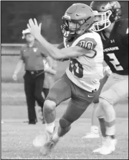  ?? Photo by Alexis Meeks ?? Bismarck quarterbac­k Ian Smith runs with the ball during a recent Lions game.