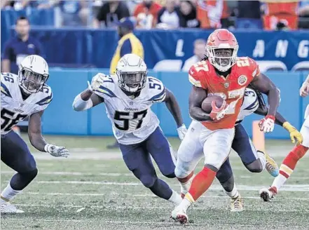  ?? Robert Gauthier Los Angeles Times ?? THE CHARGERS DEFENSE actually played a terrific game until Kansas City’s final play from scrimmage, when Chiefs rookie Kareem Hunt broke off a 69-yard touchdown run to give his team a 24-10 lead. Jatavis Brown (57) and Jahleel Addae (37) give chase.