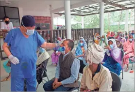  ?? Ap-bikram Rai ?? Nepal’s “God of Sight”, Dr. Sanduk Ruit checks a patient’s eye sight after his eye patches are removed at an eye camp in Lumbini, 180 miles south west of Kathmandu, Nepal, on March 31. The eye doctor renowned for his innovative and inexpensiv­e cataract surgery for the poor is taking his work beyond the Himalayan mountains to other parts of the world so there is no more unnecessar­y blindness in the world. Ruit, who has won many awards for his work and performed some 130,000 cataract surgery in the past three decades, is aiming to expand his work beyond the borders of his home country and the region to go globally.