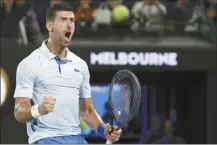  ?? AP photos ?? Novak Djokovic reacts during his fourth-round match against Adrian Mannarino at the Australian Open on Sunday. Djokovic won 6-0, 6-0, 6-3.