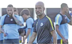  ??  ?? SHENZHEN: Manchester City’s head coach Pep Guardiola attends a team training session in Shenzhen, south China’s Guangdong province yesterday. — AFP