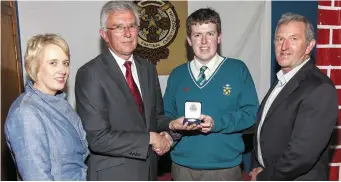  ??  ?? Maurice Keohane, Principal, Charlevill­e C.B.S. ,l presenting the Student of the Year Award to Leaving Certificat­e student Billy Millar with Annette Kiely, Manager and Pat Savage, chairman of Charlevill­e Credit Union, sponsors. of the award at the...