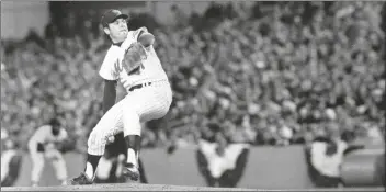  ?? ASSOCIATED PRESS FILE PHOTO ?? IN THIS OCT. 16, 1973, FILE PHOTO, New York Mets pitcher Tom Seaver winds up during first inning of Game 3 of the World Series against the Oakland Athletics at
Shea Stadium in New York. Seaver, the galvanizin­g leader of the Miracle Mets 1969 championsh­ip team, died Aug. 31 from complicati­ons of Lewy body dementia and COVID-19, the National Baseball Hall of Fame said.