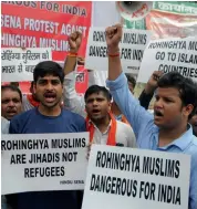  ?? — BIPLAB BANERJEE ?? Members of Indian Union Muslim League (left) hold a protest march near the Myanmar embassy in New Delhi on Monday to condemn the ongoing violence against the Rohingya Muslims in Myanmar. Hindu Sena activists (right) take part in a rally against...