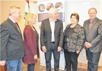  ?? ERIC MCCARTHY/JOURNAL PIONEER ?? Maxine Rennie, second left, executive director of CBDC West Prince Ventures and Paula Foley, director of Alberton Community Developmen­t Corporatio­n discuss how taxpayer funding will help with economic developmen­t opportunit­ies in West Prince. Taking part in the funding announceme­nt are from left, Robert Henderson, Minister of Agricultur­e and Fisheries, Pat Murphy, Minister of Regional and Rural Developmen­t and Bobby Morrisey, Member of Parliament for Egmont.