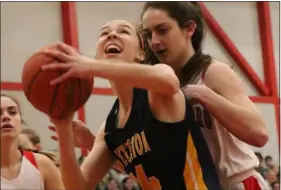  ?? JULIA MALAKIE — LOWELL SUN ?? During a state tournament basketball game, Tyngsboro’s Gianna Donato, right, defends against Littleton’s Kaylin O’meara.