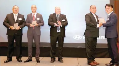  ??  ?? AWARD- WINNING CUSTOMER SERVICE HARI S-AVP for After-Sales Service Operations (4th from left) Richard Gapasin received the prestigiou­s Excellent Customer Service Achievemen­t award for the passenger cars segment from HMC EVP and COO for Internatio­nal...