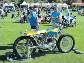  ?? ?? John Hakanson (left) shows off his survivor Champion Triumph Bonneville street tracker with original Cycle Craft glass fibre fuel tank and mudguard.