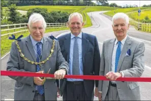  ??  ?? Mayor Cllr Malcolm Greer, David Hicken and Brian Pantony open a new road at the Kent Medical Campus, Newnham Court Way. Right, an artist’s impression of the new 75-bed care home and Linton Hospital in 1964. It was originally a Maidstone workhouse