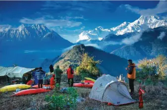  ?? Courtesy Charlie Munsey ?? Above: Lindgren and his kayaking crew camp near Tsangpo Gorge, China.