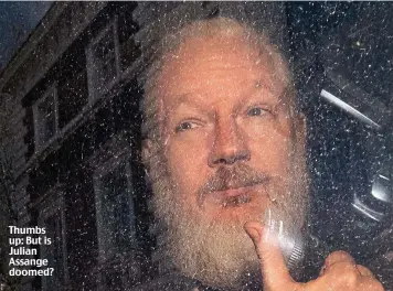  ??  ?? Thumbs up: But is Julian Assange doomed?