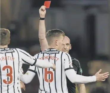  ??  ?? 0 A disbelievi­ng Lee Ashcroft is shown a red card by referee Bobby Madden for a last-man foul.