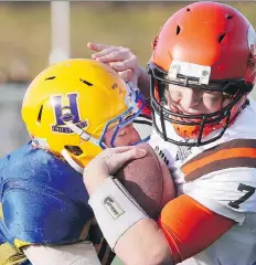  ?? RICHARD MARJAN ?? The Saskatoon Hilltops Cameron Schnitzler, left, tackles the Okanagan Sun’s Cam Bedore. Schnitzler leads the Hilltops with 32 defensive tackles, nine assists, a sack and two forced fumbles.