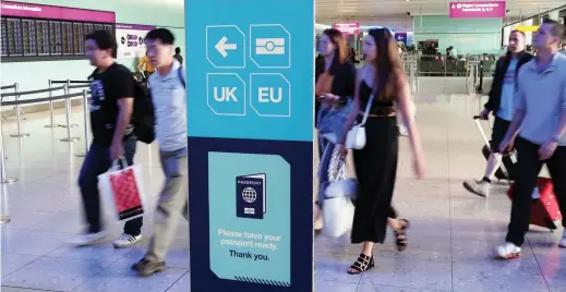  ??  ?? Passengers arriving at Heathrow, one of several airports in Europe that have been hit by delays as thousands of Gulf holidaymak­ers descend on the continent. (Reuters)