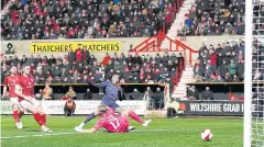  ?? ?? PERFECT PLACEMENT: Manchester City’s Gabriel Jesus, second right, scores their second goal against Swindon.