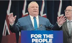  ?? CHRISTOPHE­R KATSAROV THE CANADIAN PRESS ?? Ontario Premier Doug Ford speaks to reporters with MPP Steve Clark, Minister of Municipal Affairs and Housing, in Toronto on Monday.