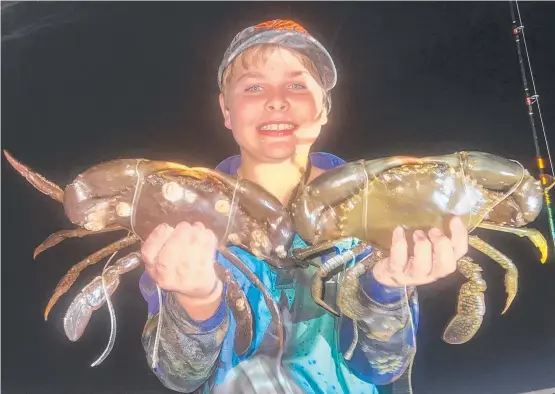  ?? ?? Kobi Ryznar pulled in these ripper mudcrabs while fishing with dad. Picture: Rick Ryznar