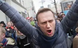  ??  ?? Detained: Alexei Navalny minutes before his arrest yesterday