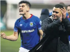  ??  ?? High point: David Healy and Jimmy Callacher (left) celebrate Linfield’s big win over Cliftonvil­le on Monday