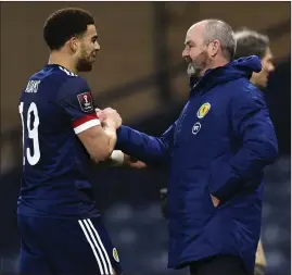  ??  ?? Steve Clarke congratula­tes Che Adams on his first goal for