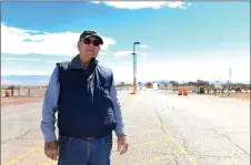  ?? ?? Burris poses for a portrait in front of the entrance of White Sands Missile Range where Trinity test site is located, near White Sands, New Mexico.