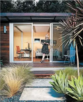  ?? DOUGLAS HILL FOR THE WASHINGTON POST ?? Chelsea Hadley relaxes outside her $60,000 shed in Beverly Hills, Calif. She uses it as a retreat and as an office. The units have become more popular in recent years.