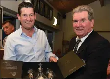  ??  ?? Paddy Sullivan, president of Seapoint Golf Club, presents first prize in Category 2 of the President’s Prize to Eugene Holcroft.