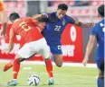  ?? PATTARAPON­G CHATPATTAR­ASILL ?? Sirod Chatthong, right, in action against China.