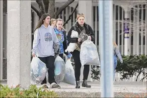  ?? Photos by Lori Van Buren / Times Union archive ?? University at Albany students left their dorms in March 2020 as the school took precaution­s in the early days of the COVID-19 pandemic.